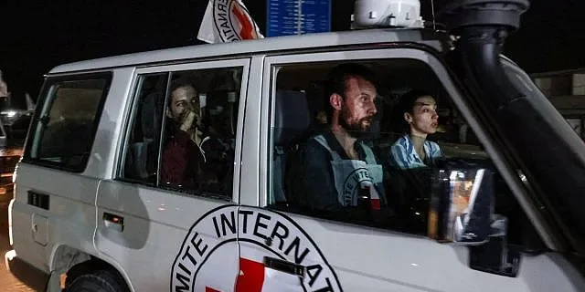 Illustrative: An International Red Cross vehicle carrying Israeli Russian hostage Ron Krivoy released by Hamas drives towards the Rafah border point with Egypt ahead of a transfer to Israel on November 26, 2023. (Mohammed ABED / AFP)