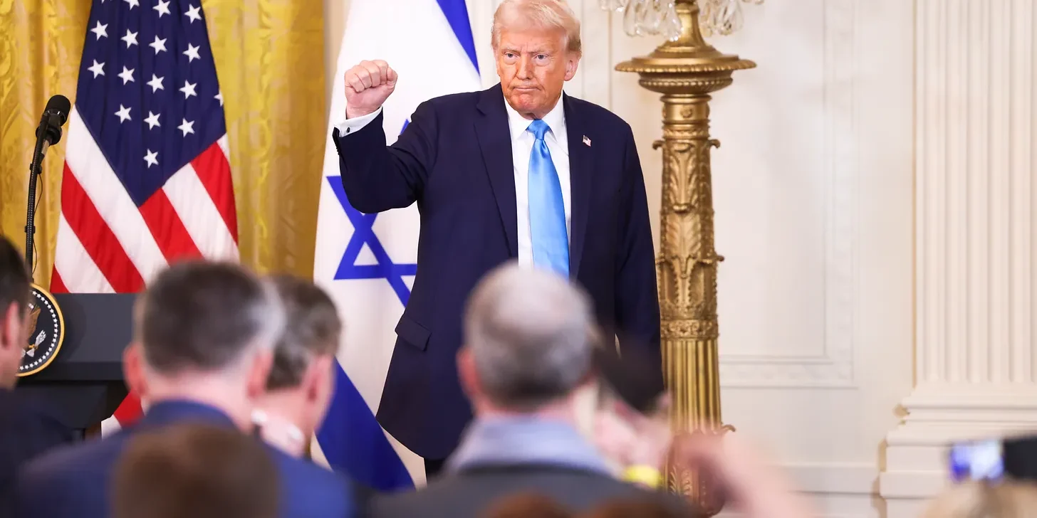 President Donald J. Trump pumps Sipa via AP Images