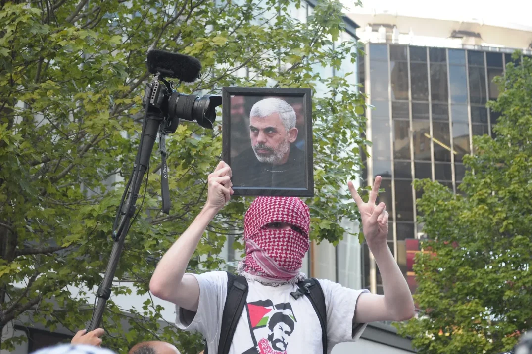 A pro Palestine demonstrator holds up a photo of Yahya Sinwar during a rally in New York City, July 2024 Sipa via AP images