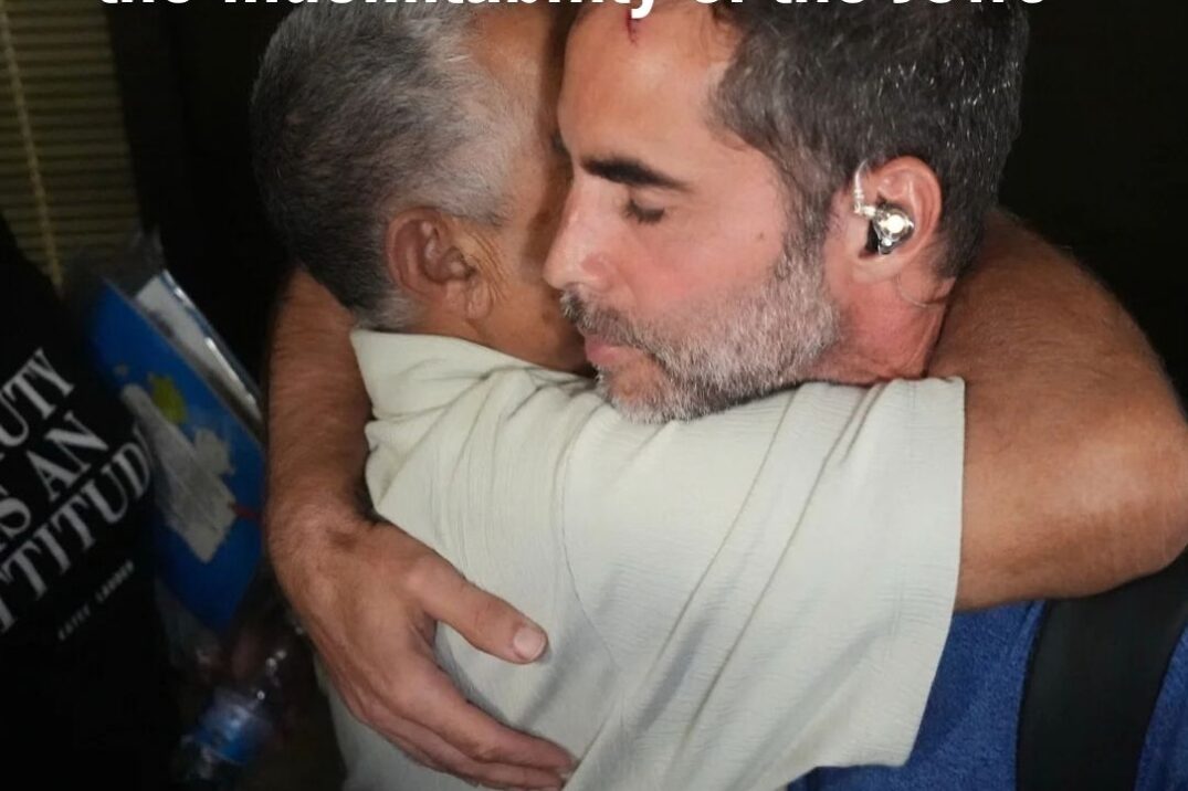 Israeli passenger of flydubai Flight FZ1073 hugs another passenger at Ben Gurion Airport