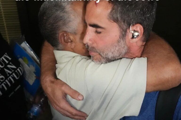 Israeli passenger of flydubai Flight FZ1073 hugs another passenger at Ben Gurion Airport